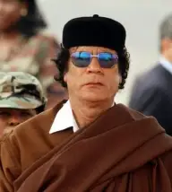 Kadhafi pleacă să cumpere arme