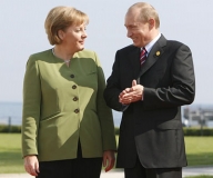 Putin se va intâlni cu Merkel