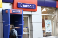 Criza la bănci: Bancpost a redus personalul cu 10% şi a închis 7 unităţi