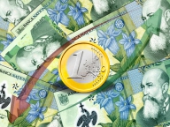 Leul scade faţă de euro şi creşte faţă de dolar