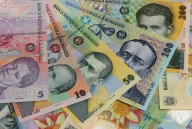 Cursul a coborât la 4,1641 lei/euro