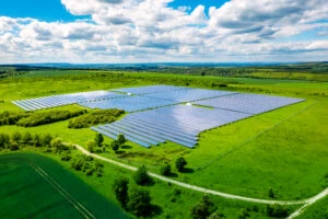 Aerial view over Solar cells energy farm in countryside landscape