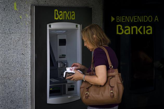 Spania este pe drumul cel bun cu reforma sistemului bancar, consideră Comisia Europeană
