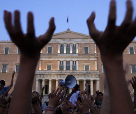 REVISTA PRESEI INTERNAŢIONALE – Parlamentul grec a votat pentru austeritate în timp ce manifestanţii erau în stradă